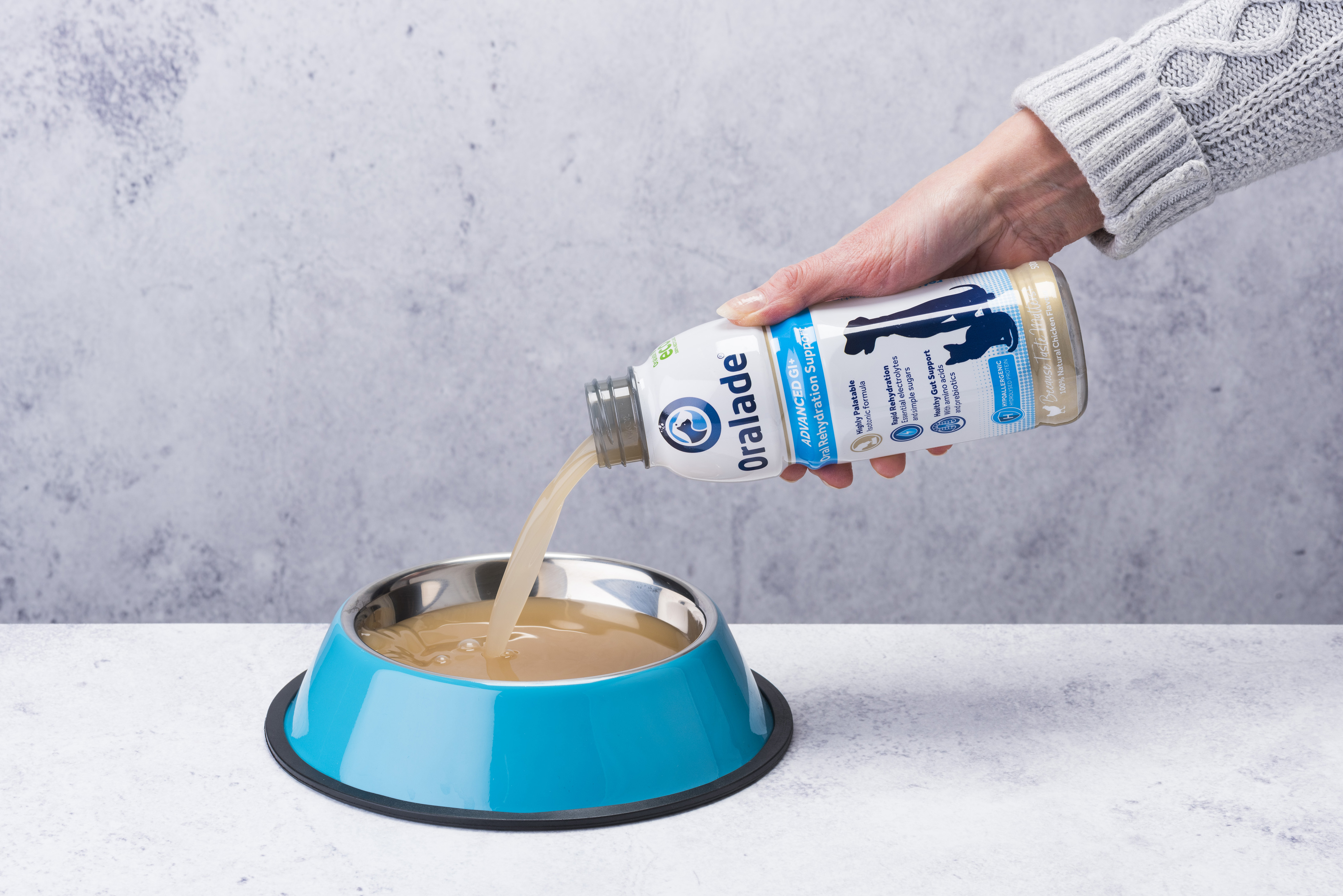 Oralade GI+ being poured into pet bowl