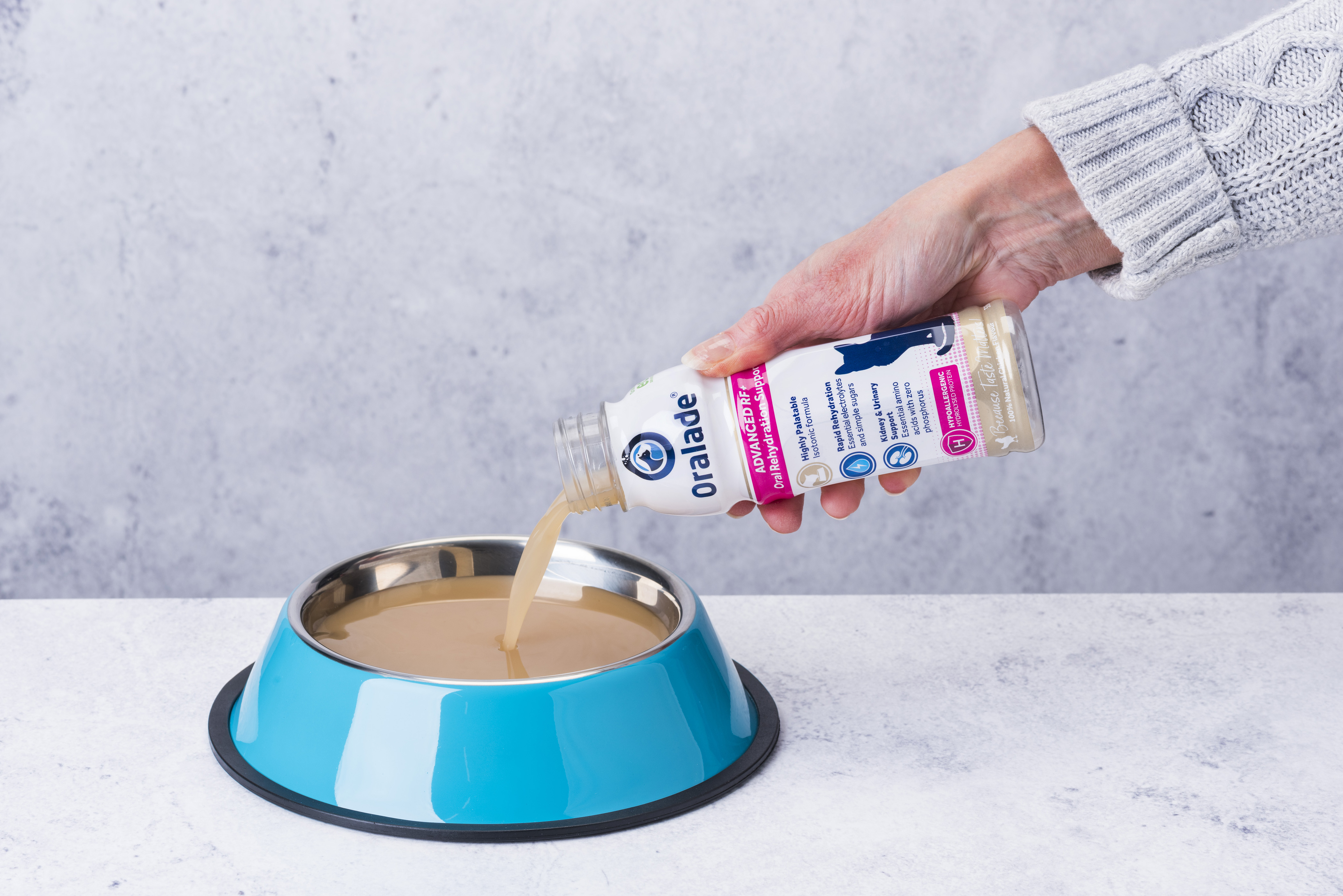 Oralade RF+ being poured into pet bowl
