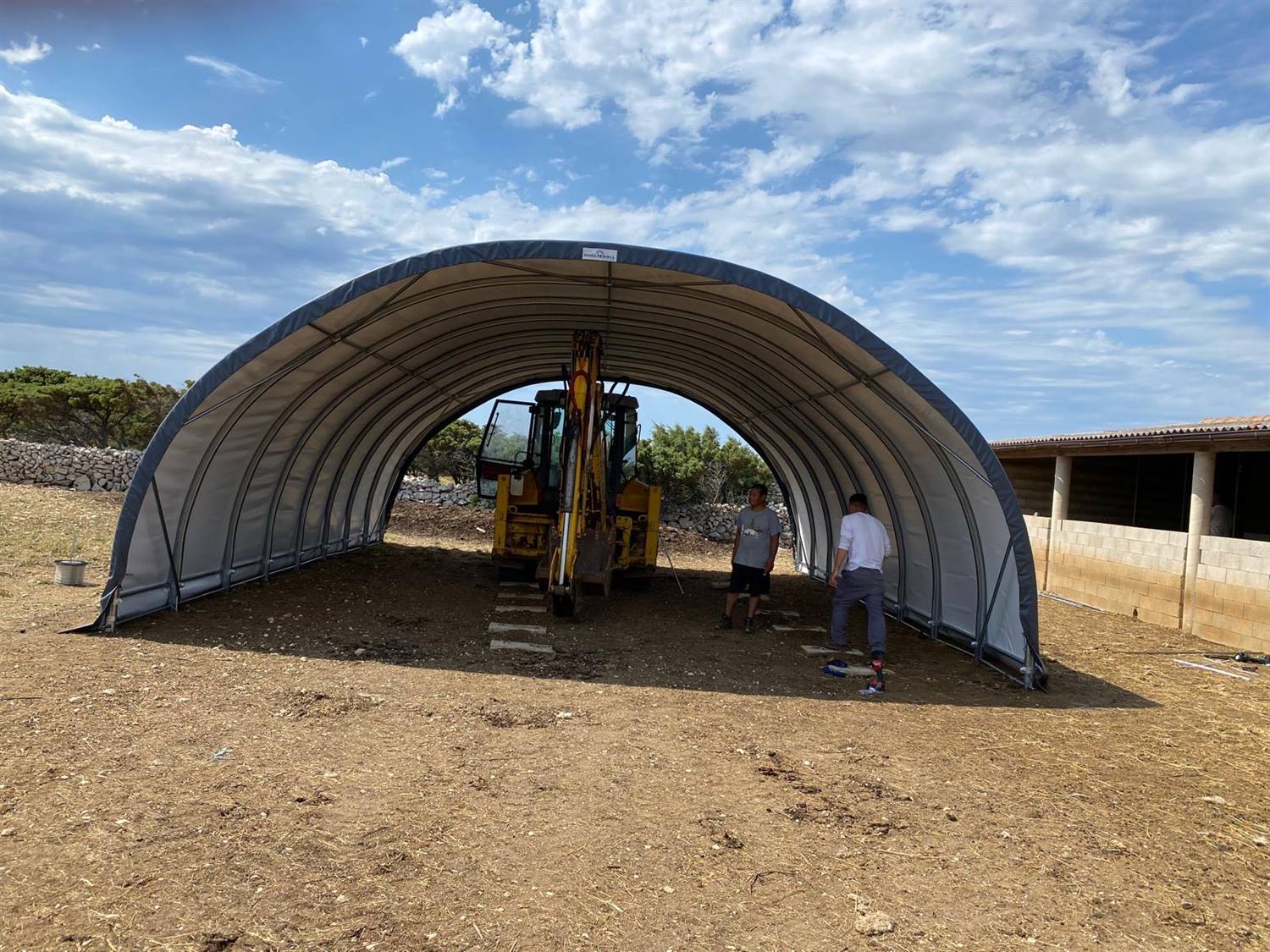 PVC cover fitted over the tunnel frame by the crew